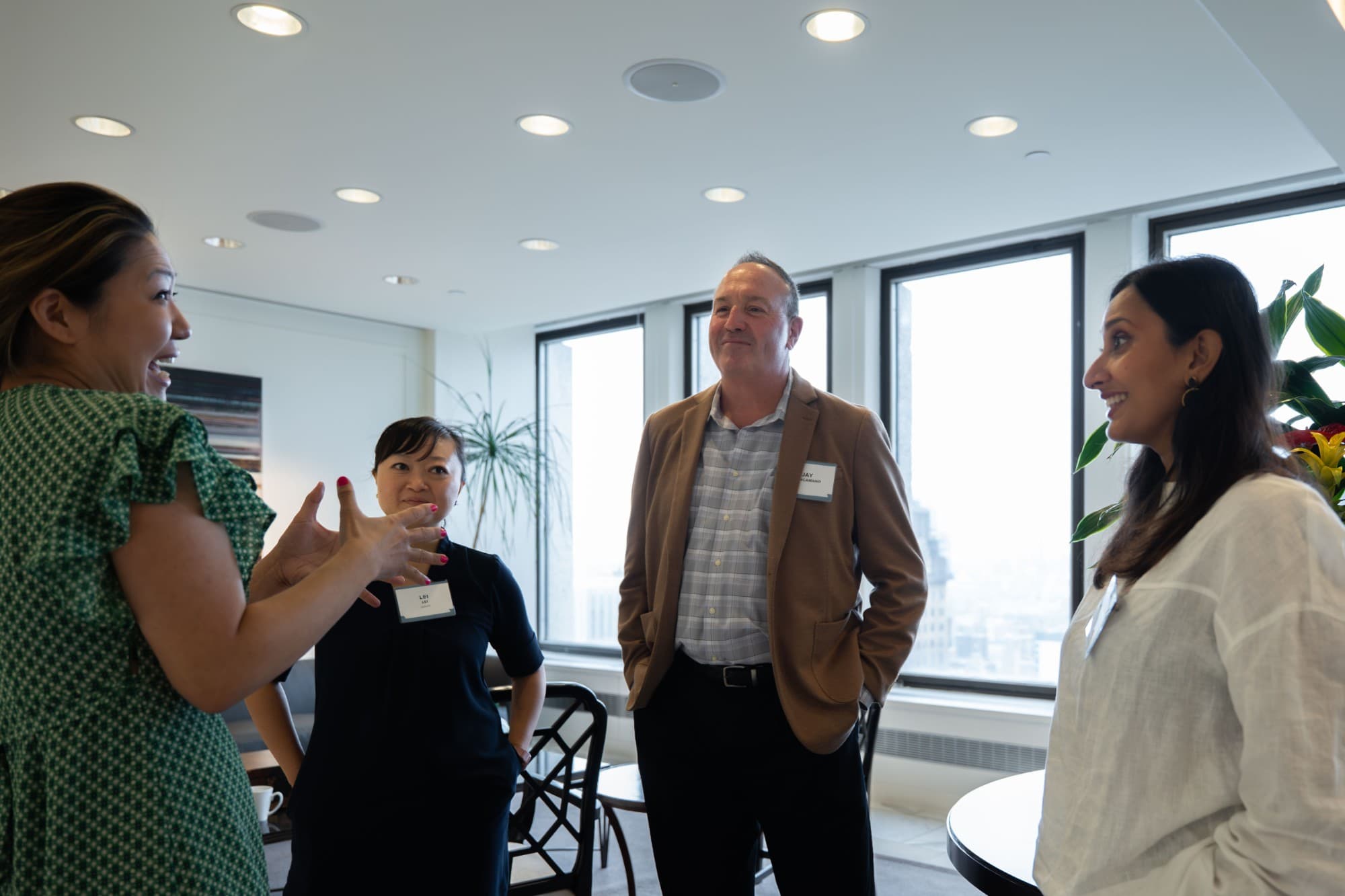 Collaboration City members talking at a networking event